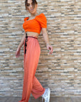 Pantalone palazzo in licra con cintura in vita - colore arancione - Jiumir